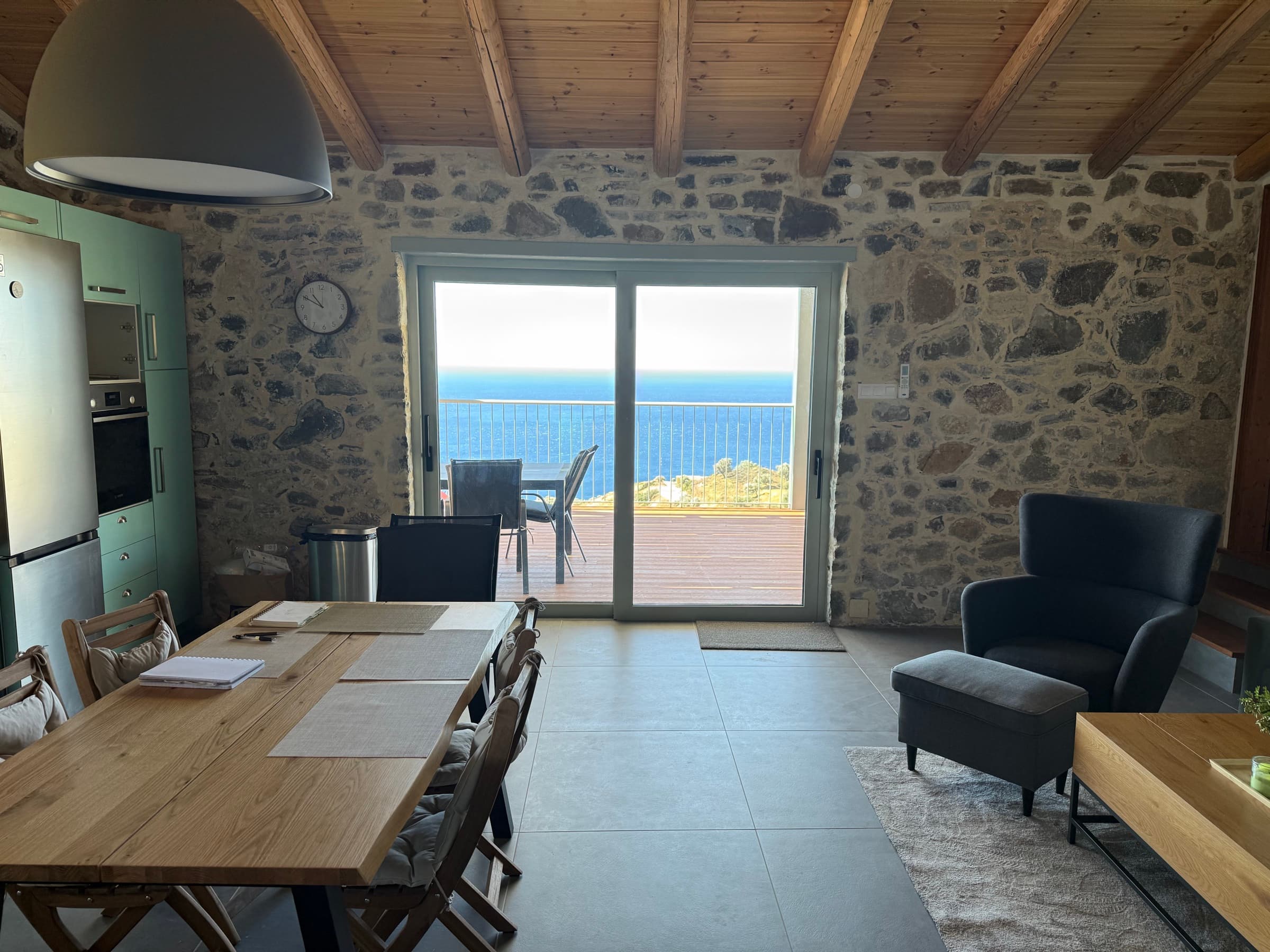 Open-plan kitchen and dining with the Libyan Sea beyond the balcony doors