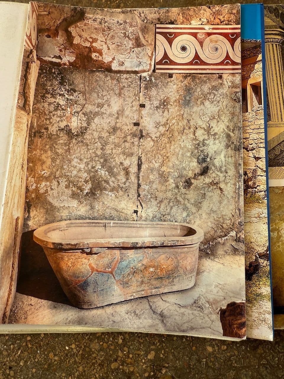 A guidebook page showing the painted clay bathtub from the palace