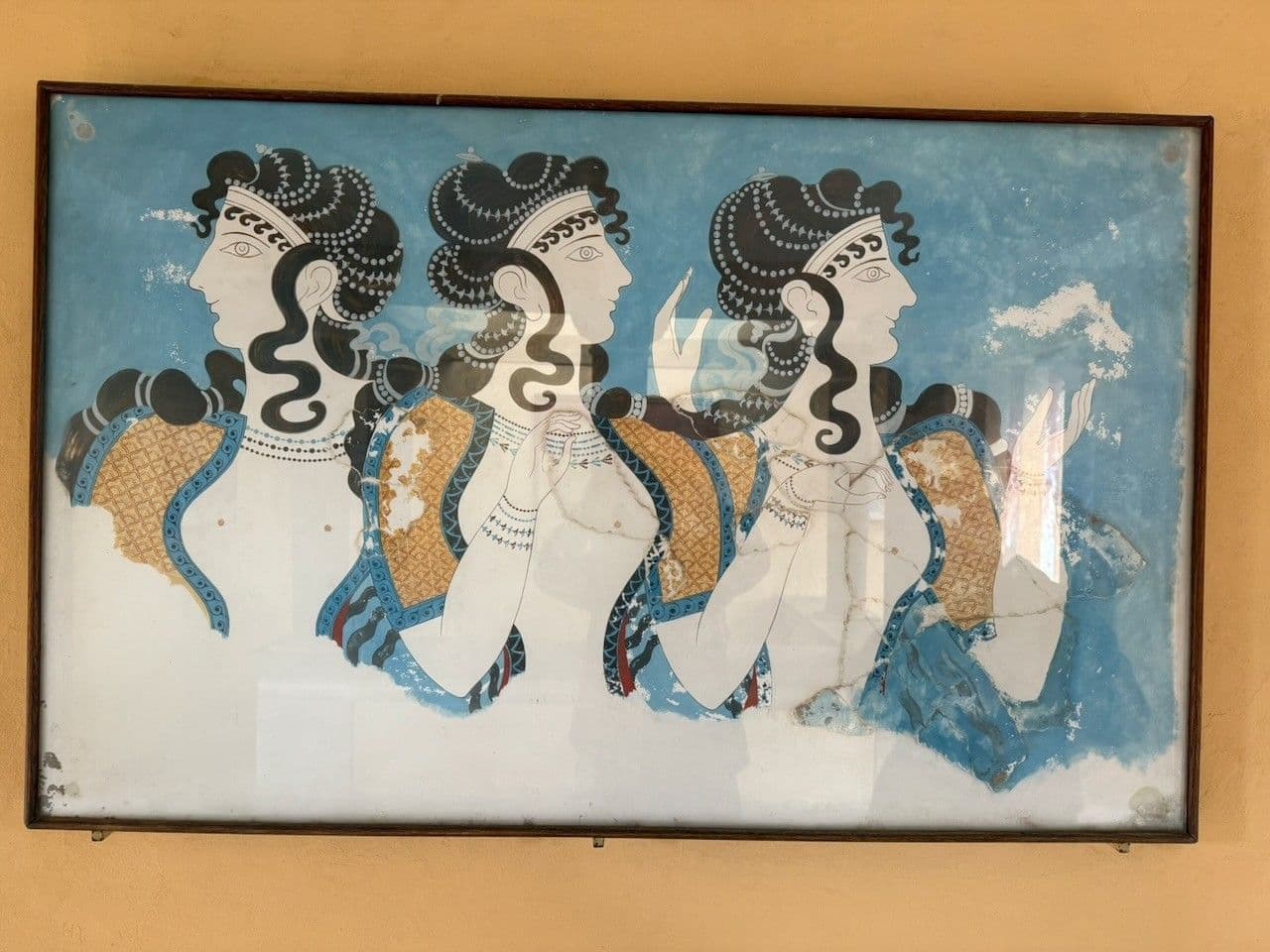 The Ladies in Blue fresco, three women with elaborate hair against a blue ground
