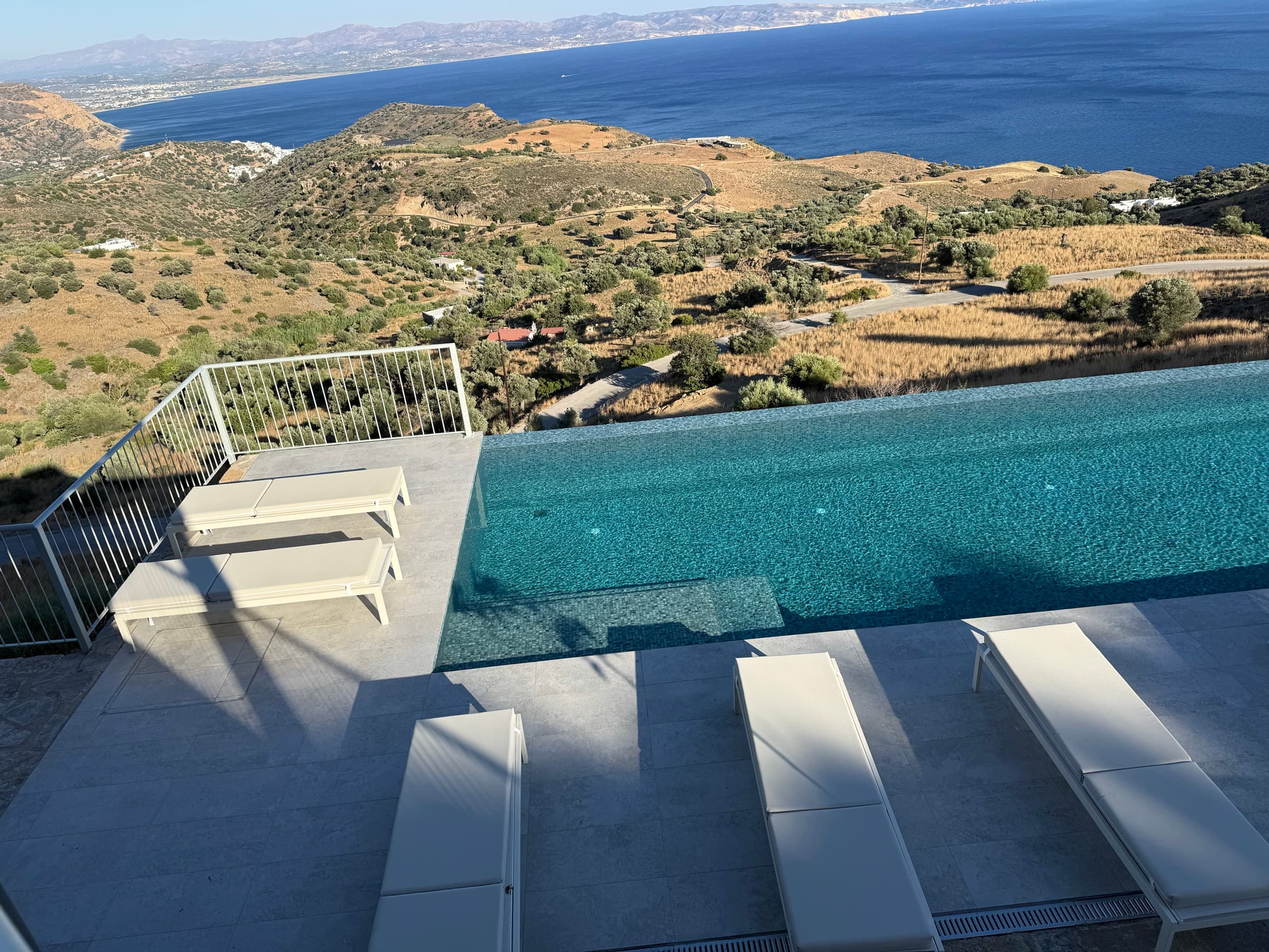 Aerial view of the infinity pool and terraces above the sea